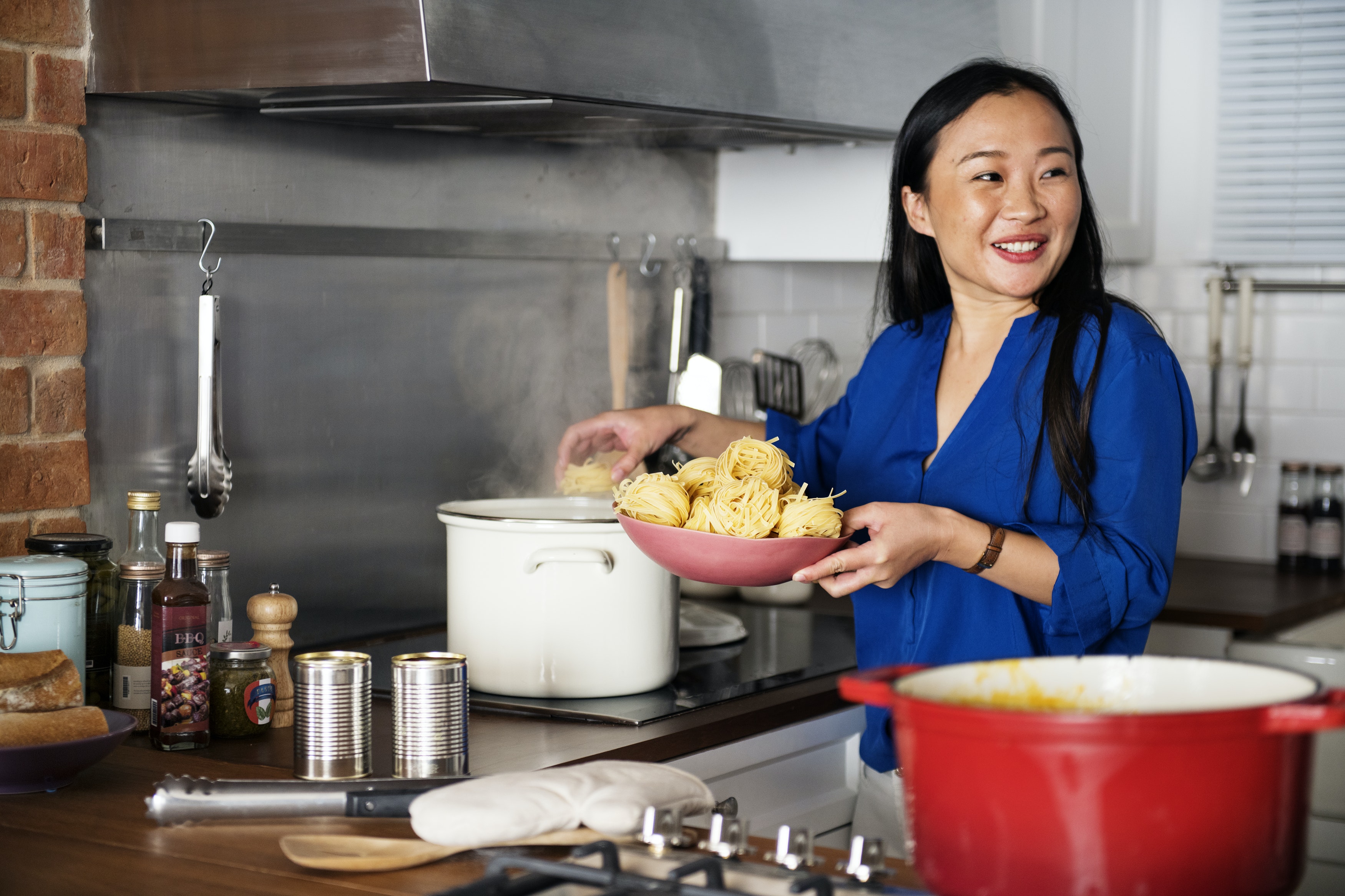 Asian lady cooking in the workplace